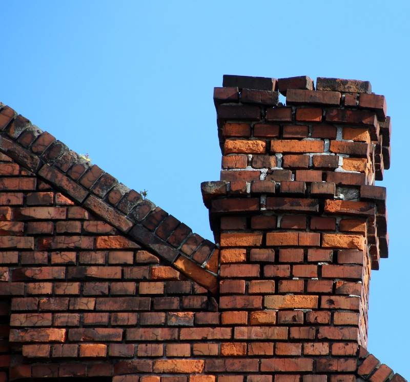 Signs Your Richmond Home Needs a Chimney Inspection Damaged chimney on an Richmond home showing cracks and missing mortar